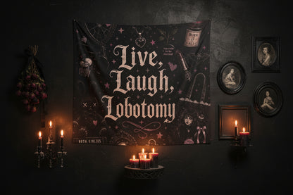 A gothic-themed wall tapestry featuring the text 'Live, Laugh, Lobotomy' in a distressed white font, surrounded by dark illustrations including a skeleton, a bottle labeled 'Burn It All', a syringe, and small pink stars and hearts on a black background.