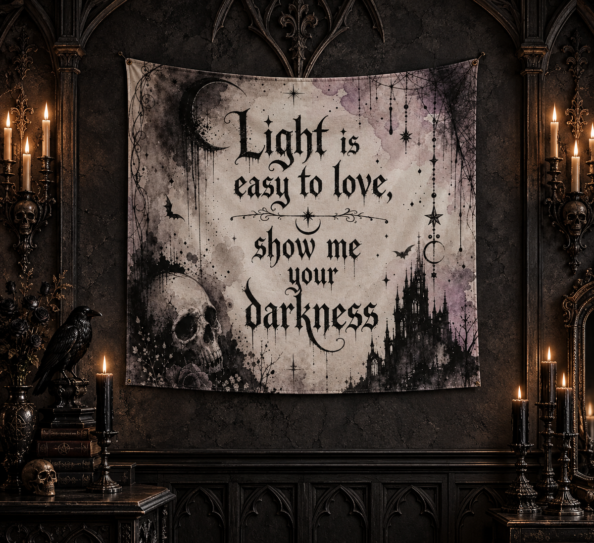 A gothic-themed wall tapestry hanging in a dark, candle-lit room. The tapestry features a distressed, grunge-style design with a skull, moon, candelabra, and castle silhouettes, with the text 'Light is easy to love, show me your darkness' written in a black gothic font.